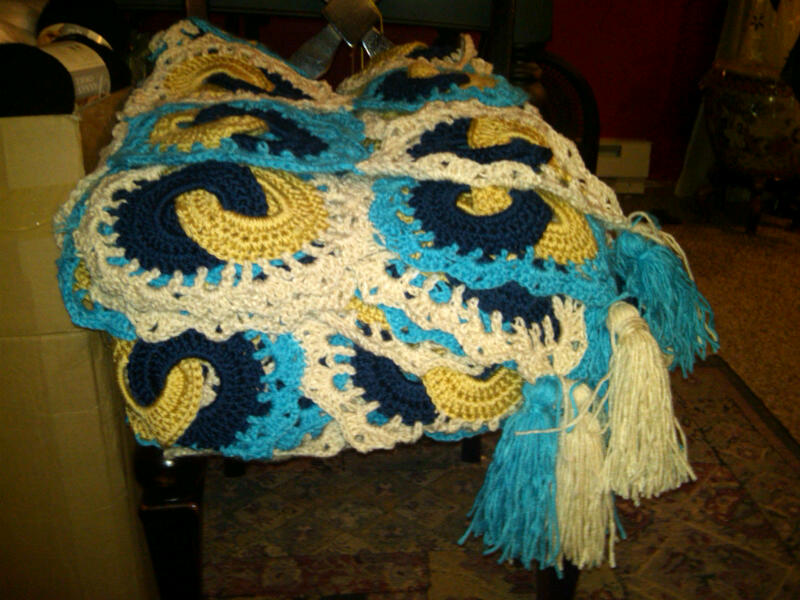 folded afghan with tassels